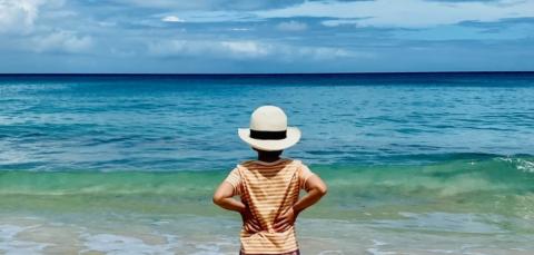 The image shows a picturesque beach scene