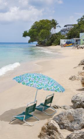 The image depicts a serene beach scene