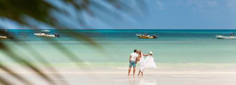 This image captures a romantic and serene beach scene