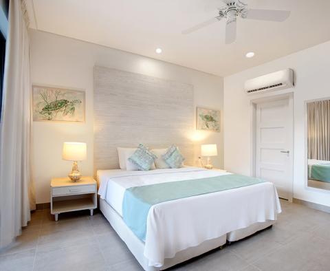 The image shows a neatly decorated modern bedroom