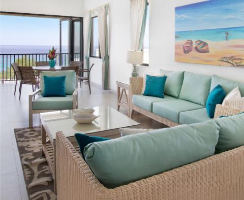 This image shows a sophisticated living room with a coastal decor theme
