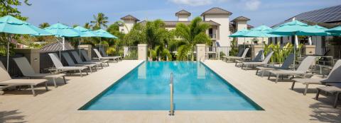 This image depicts a well-maintained outdoor swimming pool area