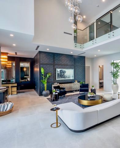 This image displays a modern and spacious interior of a luxury home