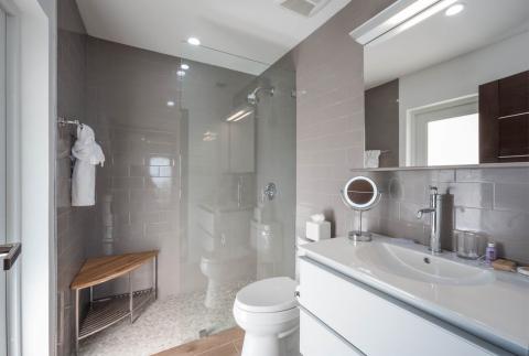 This image shows a modern, well-lit bathroom