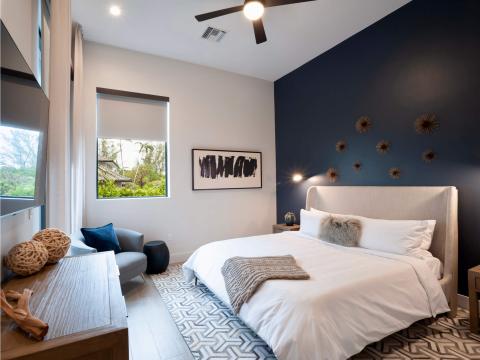 This image depicts a modern and stylish bedroom