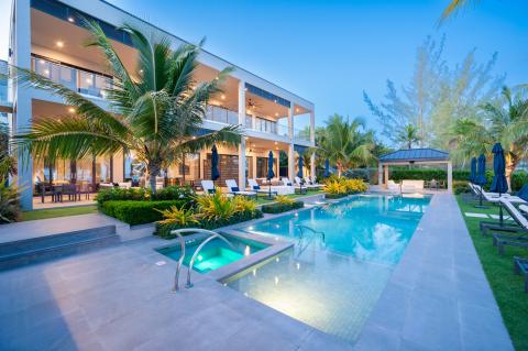 This image features a luxurious outdoor setting at twilight