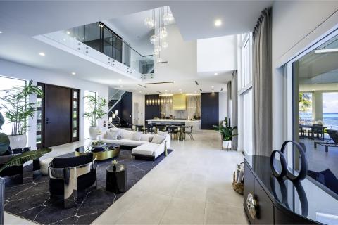 This image showcases a luxurious and modern interior of a beachfront property