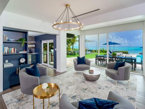 This image showcases an elegantly designed living space with a seamless indoor-outdoor connection