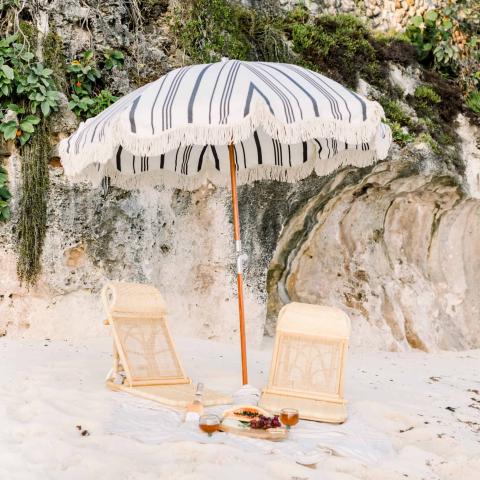 The image features a nicely set up serene beach scene