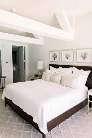 The image shows a modern and neatly arranged bedroom