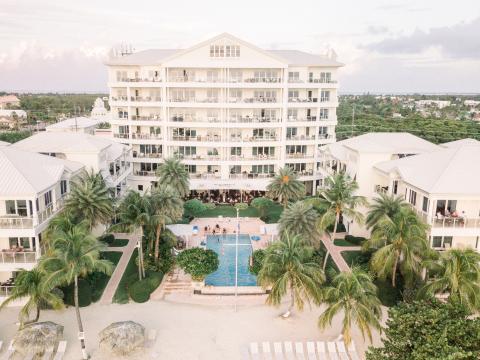 The image shows an aerial view of a luxury resort complex