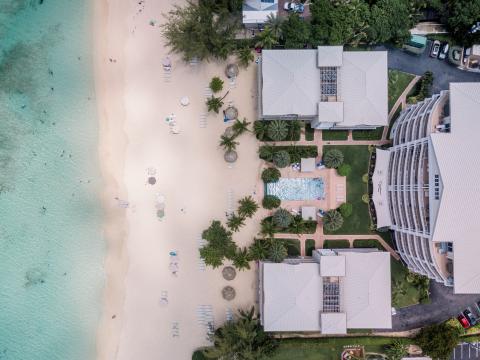 This image shows an aerial view of a tropical beach resort