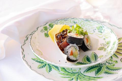 The image shows a beautifully presented sushi dish