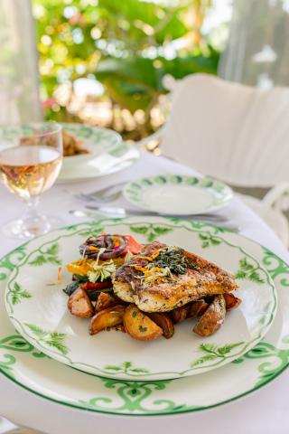 This image shows a plated meal at an outdoor dining setting, possibly at a restaurant
