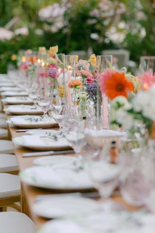 This image features an elegantly set outdoor dining table