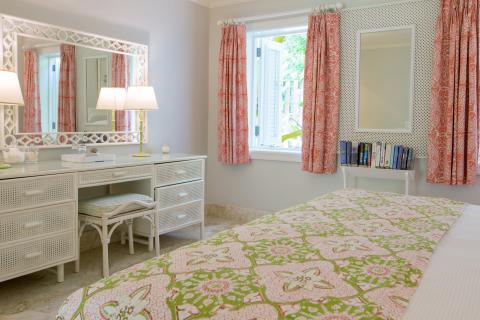 This image shows a bright and neatly decorated bedroom
