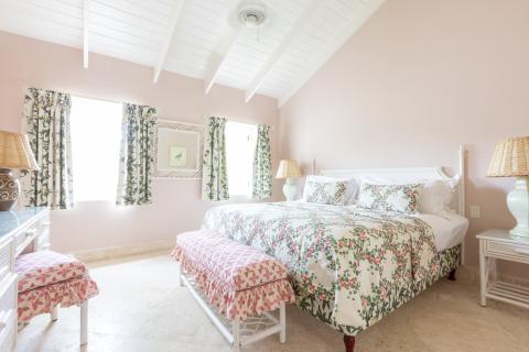 This image shows a cozy, brightly lit bedroom