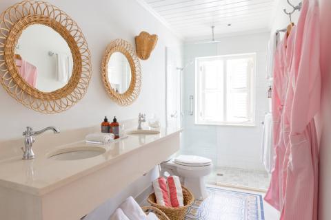 This is an image of a bright and stylish bathroom