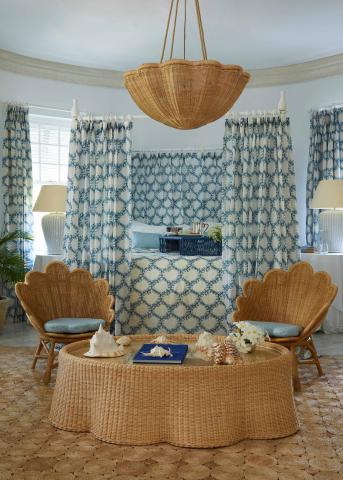 This image showcases an elegantly decorated room with a coastal or beach-inspired theme, mainly featuring blue and natural tan colors