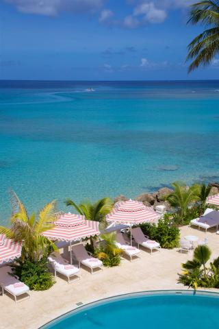 The image features a stunning tropical beach resort setting