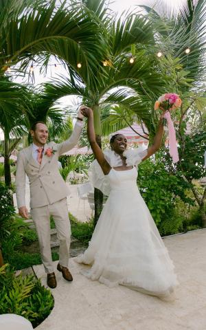 This image captures a joyful moment at a wedding