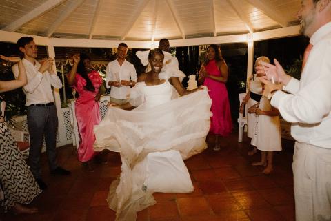 This image captures a joyful moment at a wedding celebration