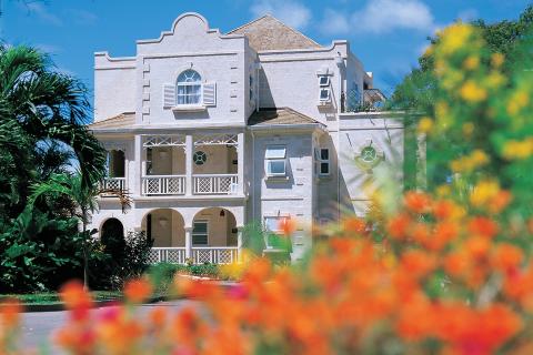 The image features a charming two-story building with classic architectural details
