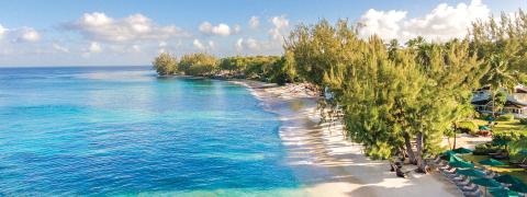 The image shows a beautiful beachfront scene