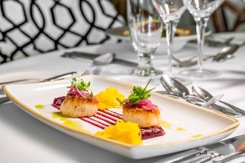 This image shows a beautifully plated gourmet dish, likely served at a high-end restaurant
