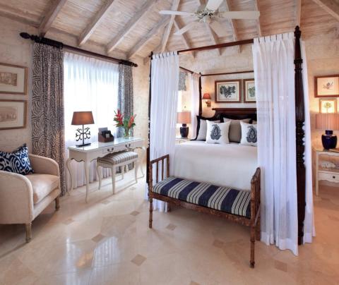 The image shows a beautifully decorated bedroom, featuring a tropical or coastal style design