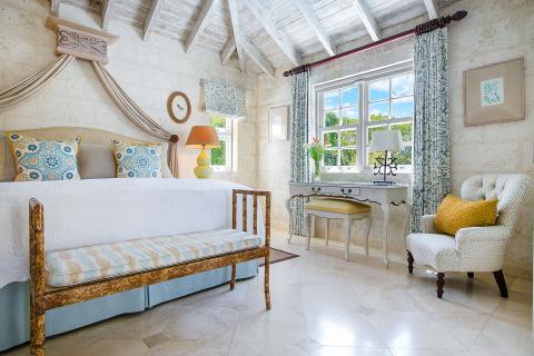 This image shows a beautifully decorated bedroom with a vintage or antique style