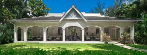 This image shows a luxurious, single-story building with characteristics of a tropical resort-style architecture