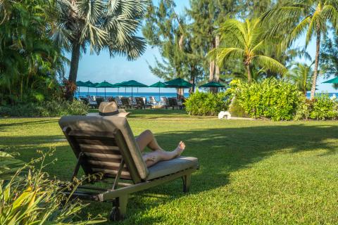 This image depicts a tranquil beach resort setting
