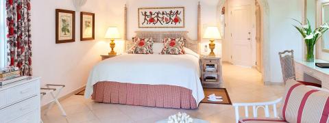 This image features a well-appointed bedroom with a bright and inviting decor