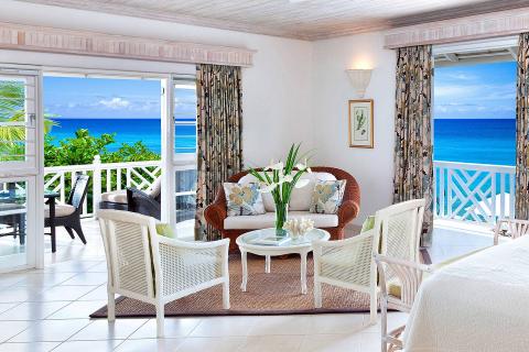 The image shows a beautifully decorated room with a coastal theme