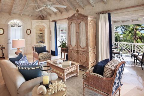 This image shows a beautifully decorated room in a tropical or coastal style