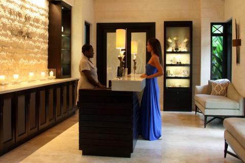 This image depicts an interior scene of an upscale spa reception area