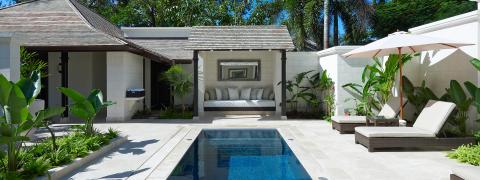 This image showcases a luxurious outdoor area that appears to be part of a high-end residential or resort setting