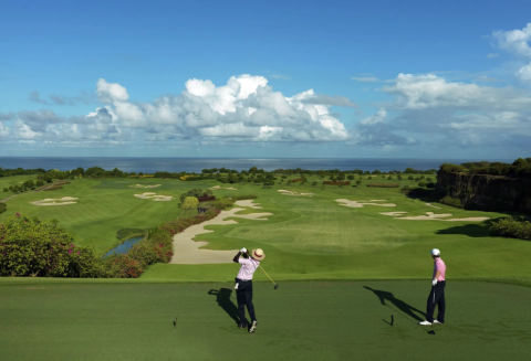The image features a vibrant and scenic golf course