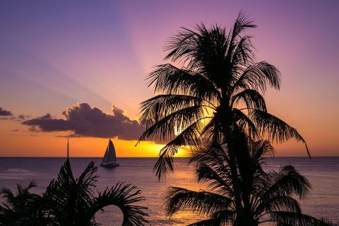 This image features a beautiful sunset over the ocean