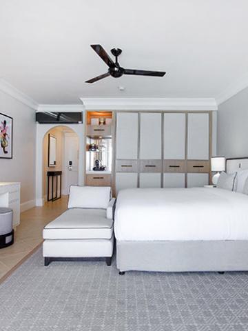The image shows a modern and neatly arranged bedroom