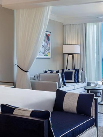 The image shows a stylish and modern hotel room