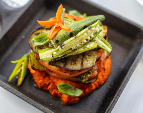 This image features a beautifully presented dish consisting of grilled vegetables