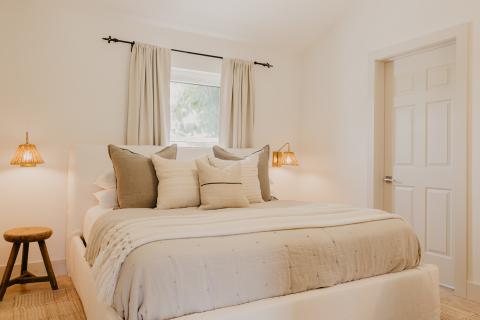 The image shows a neatly arranged bedroom