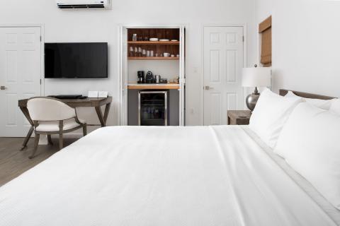 This image showcases a modern, neatly arranged bedroom