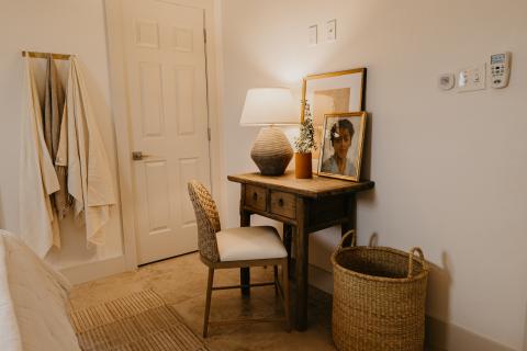 The image depicts an elegantly arranged interior room corner