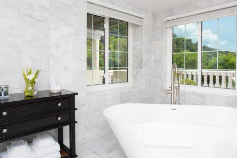 This image shows a luxurious bathroom with a modern aesthetic