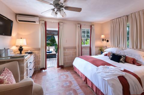 The image shows a well-furnished, inviting bedroom