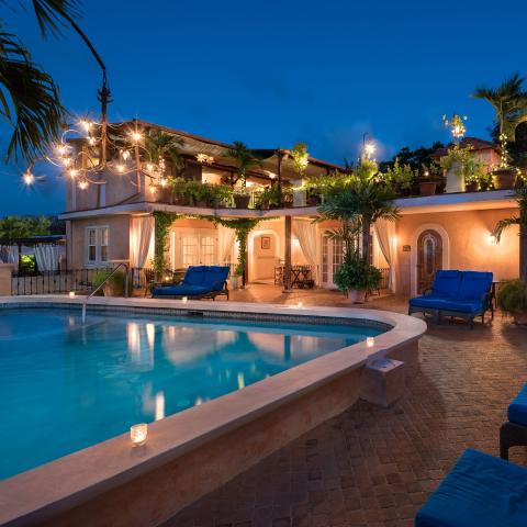 This image displays a luxurious outdoor setting at dusk