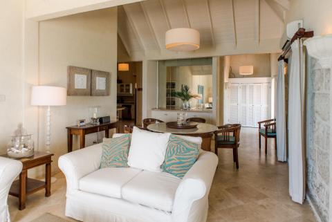 This image shows the interior of a residential room, designed in a relaxed, coastal style